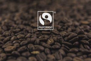 Certified Fairtrade logo overlaid on coffee beans
