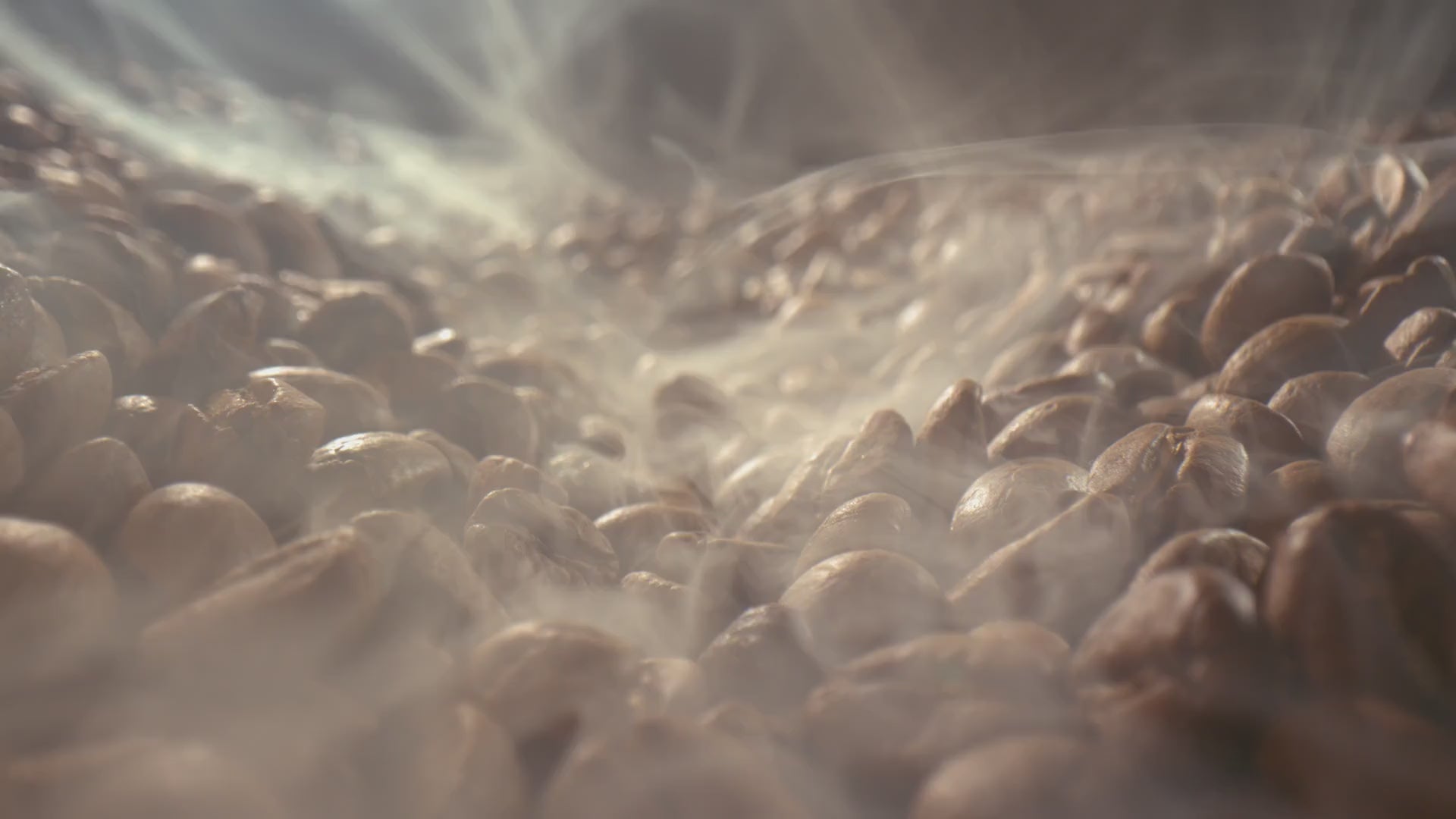 A cinematic slow motion close up pan over freshly roasted coffee beans (roasted-to-order) with hot steam coming off of them. 